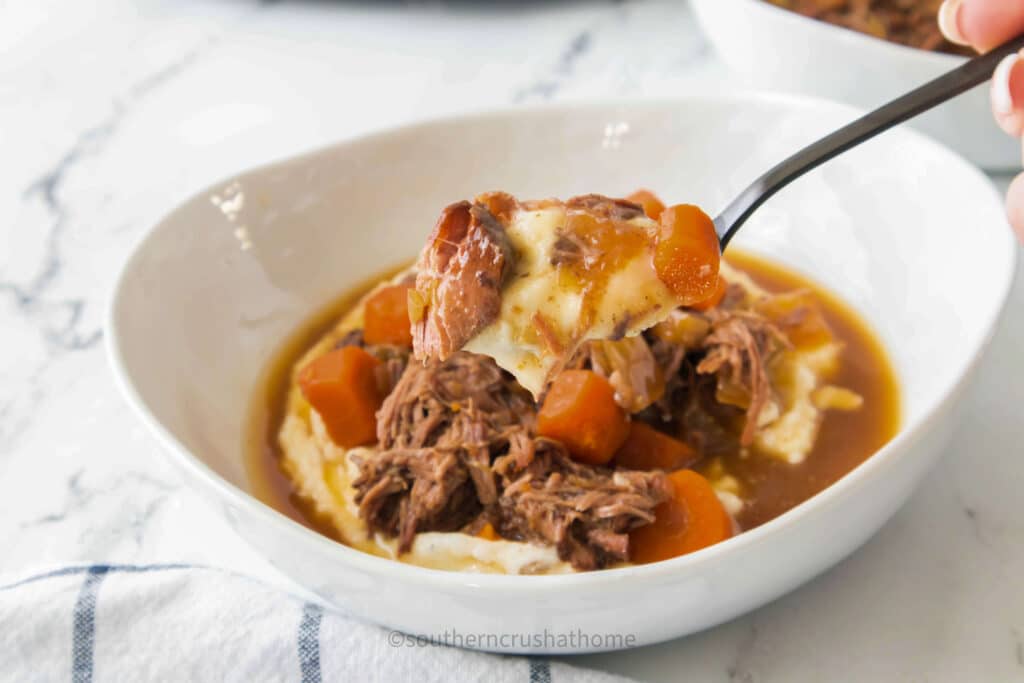 spoonful of pot roast with mashed potatoes
