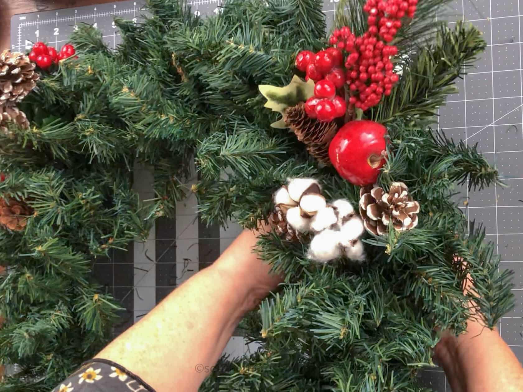 adding a spray to a wreath