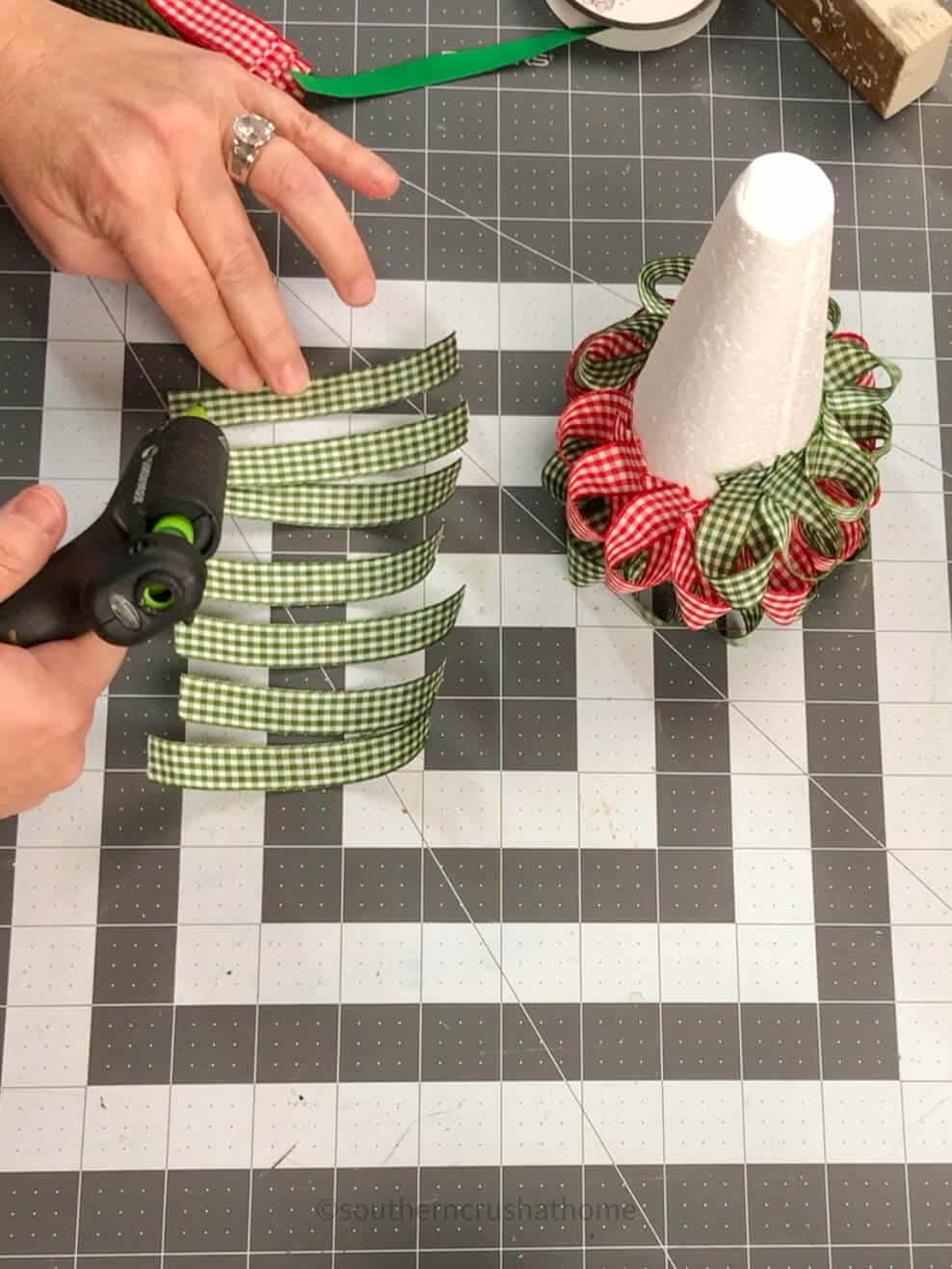 adding glue to strips of ribbon