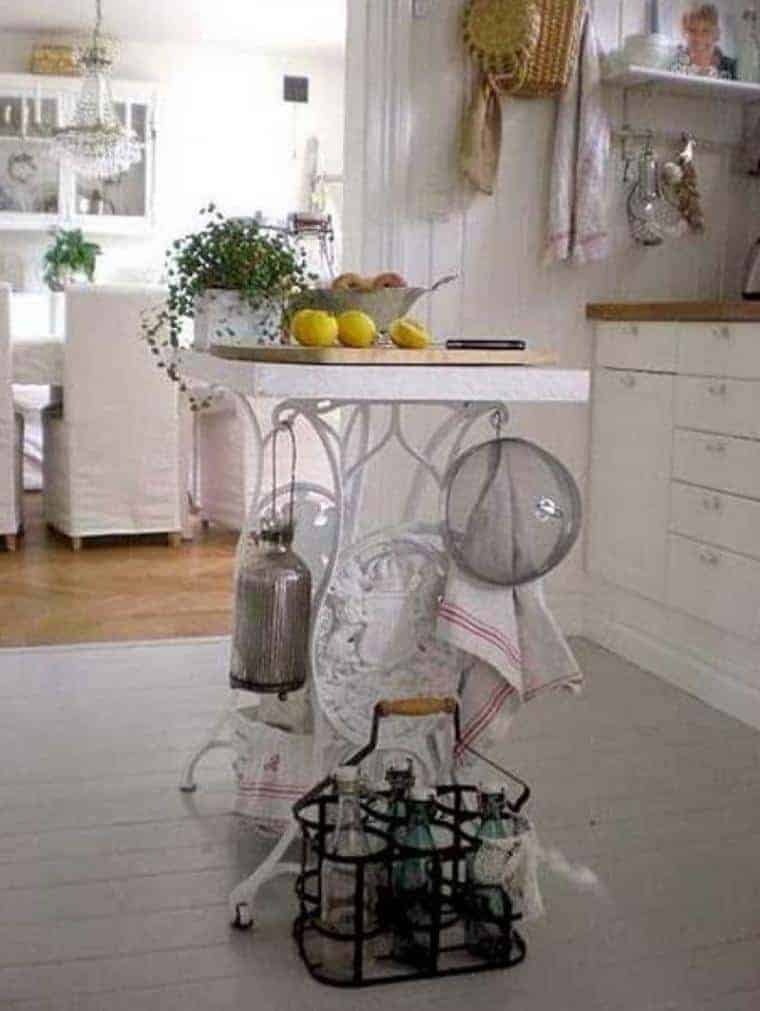 sewing machine table painted white as kitchen island