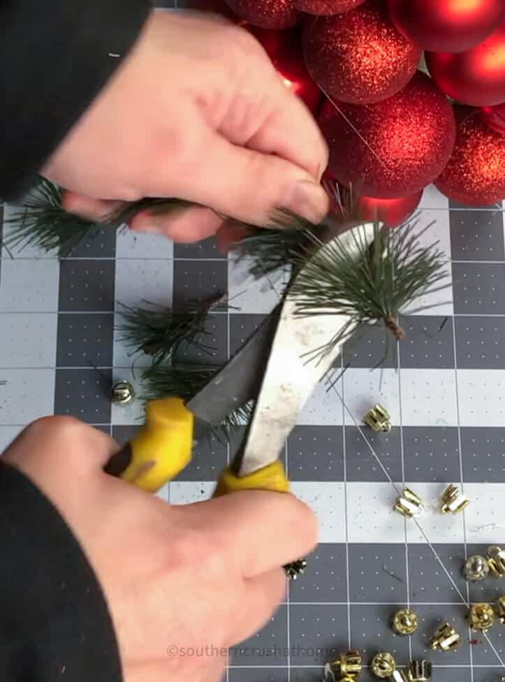 cutting greenery with wire cutters
