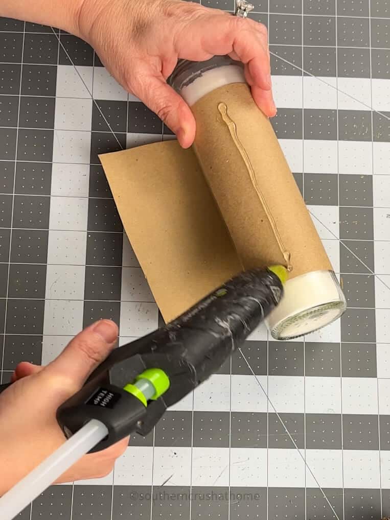 gluing wrapping pillar candle with printable