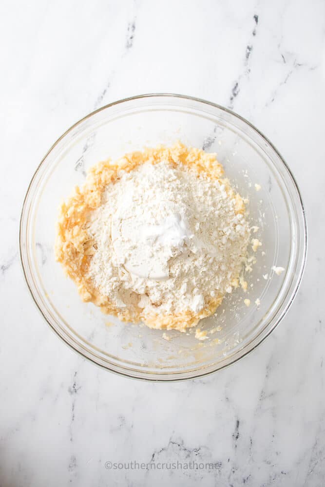 adding dry ingredients to bowl