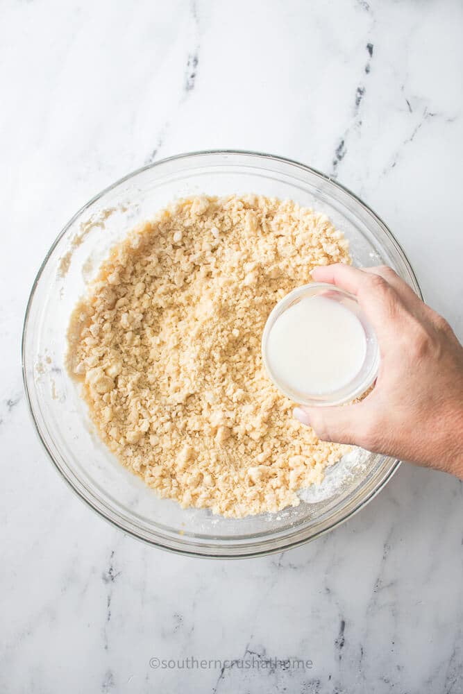 adding milk to bowl