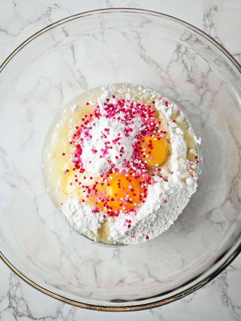 sprinkles and eggs in mixing bowl