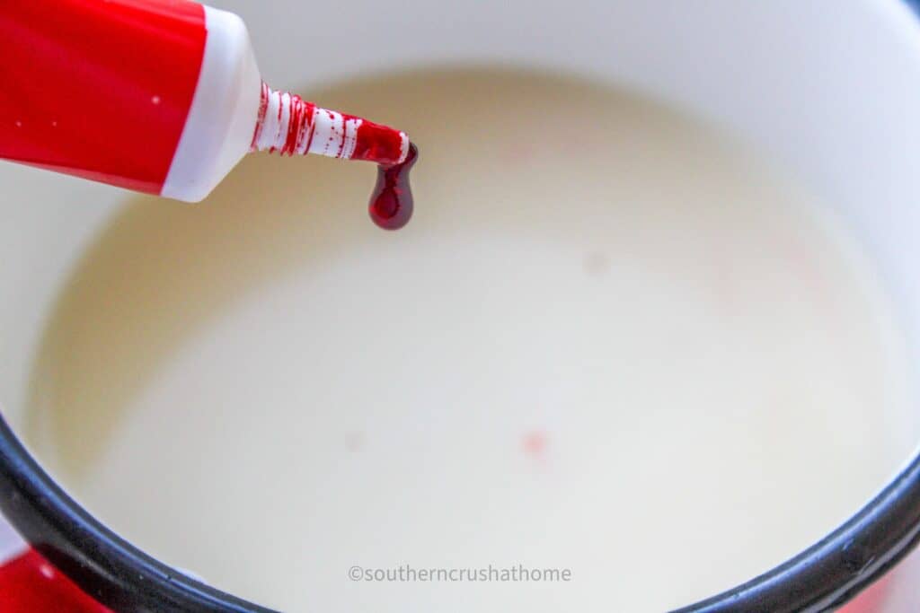 adding red food coloring