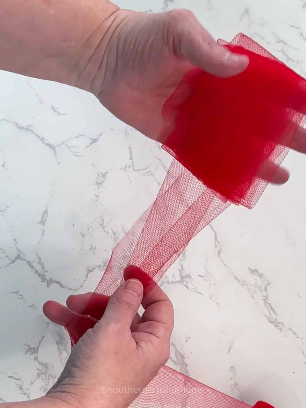 wrapping tulle around fingers