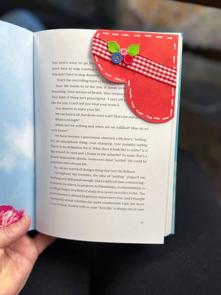 paper heart bookmark displayed on a book page