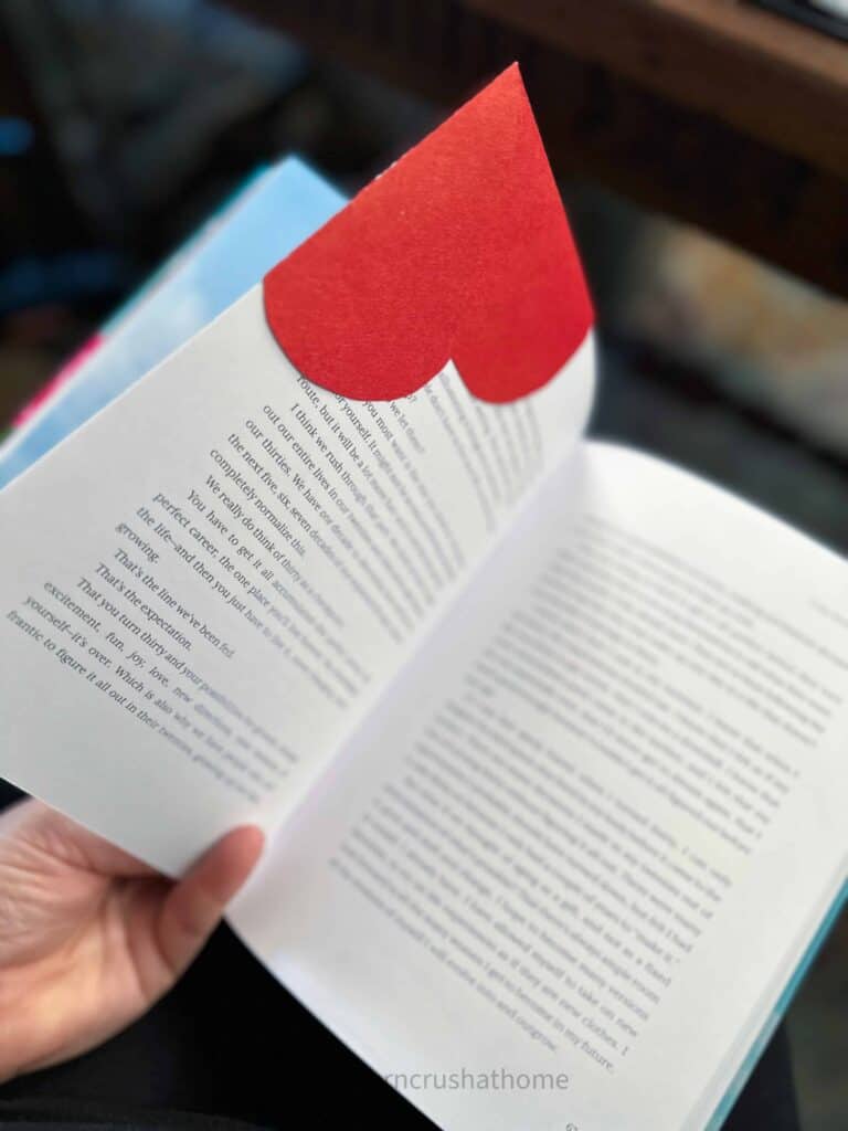 backside of paper heart bookmark on book page