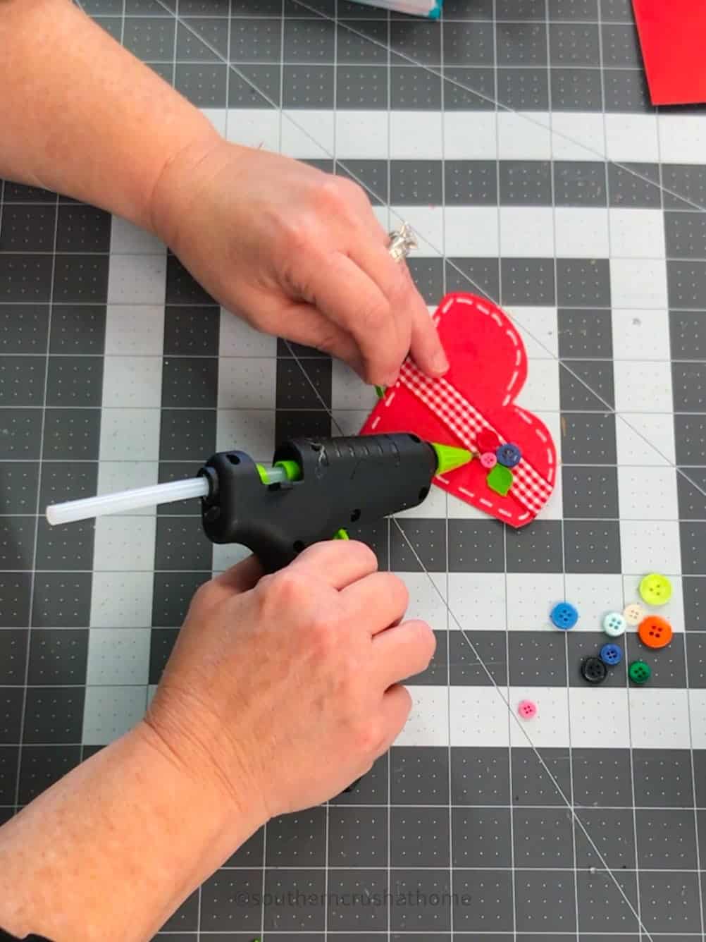 gluing leaves on paper heart