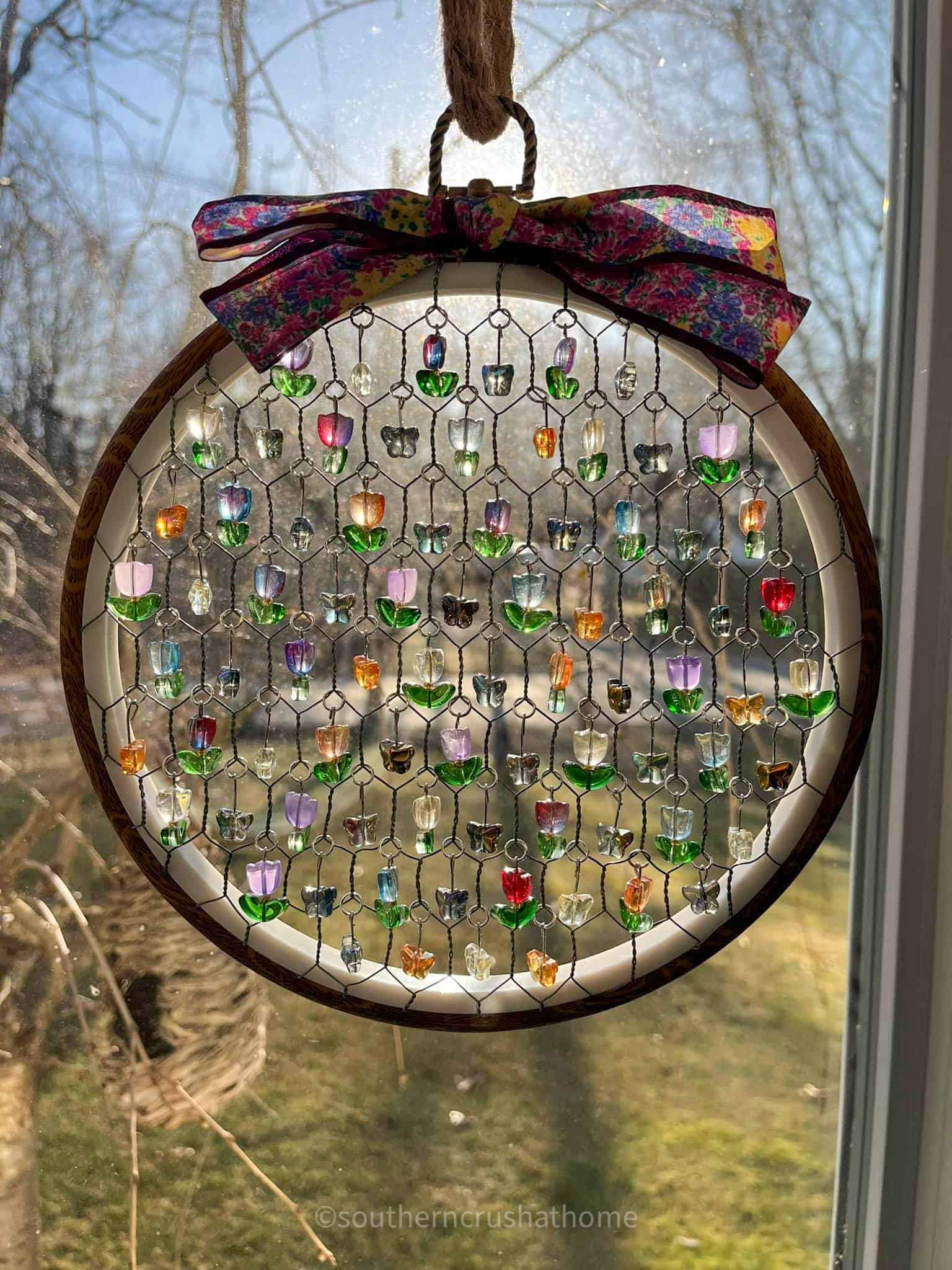round multi-color chicken wire sun catcher with flowers