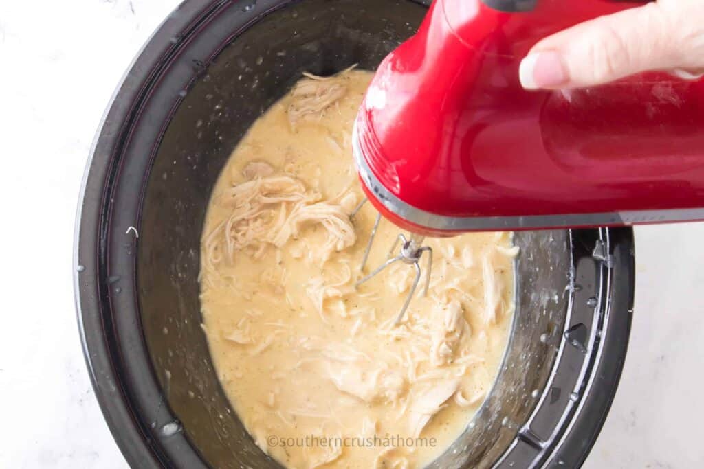 mixing Chicken and Gravy with hand mixer