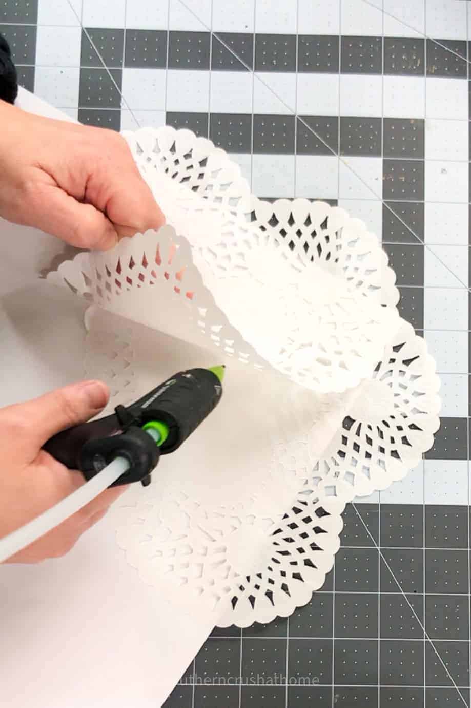 gluing doilies to scrapbook paper