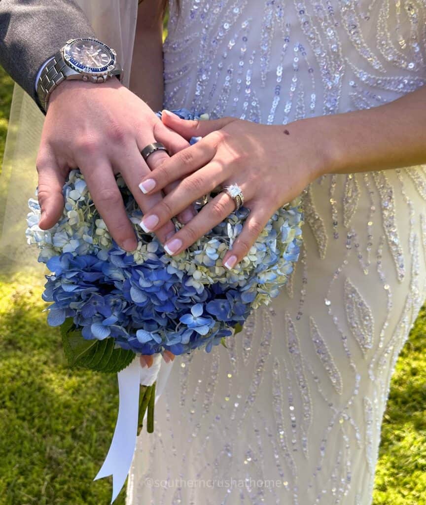 hands on bridal bouquet