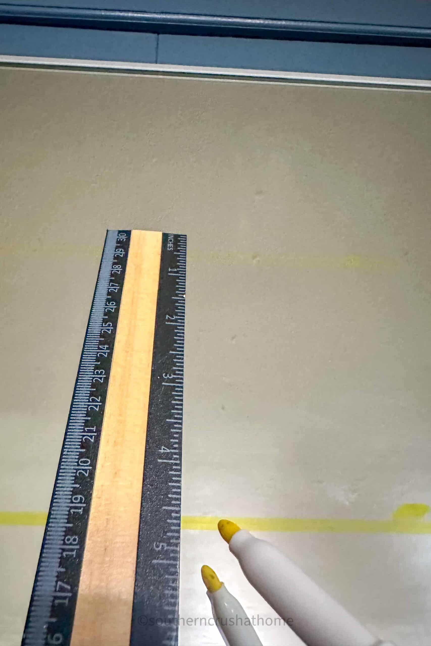 ruler and dry erase marker for measuring design placement