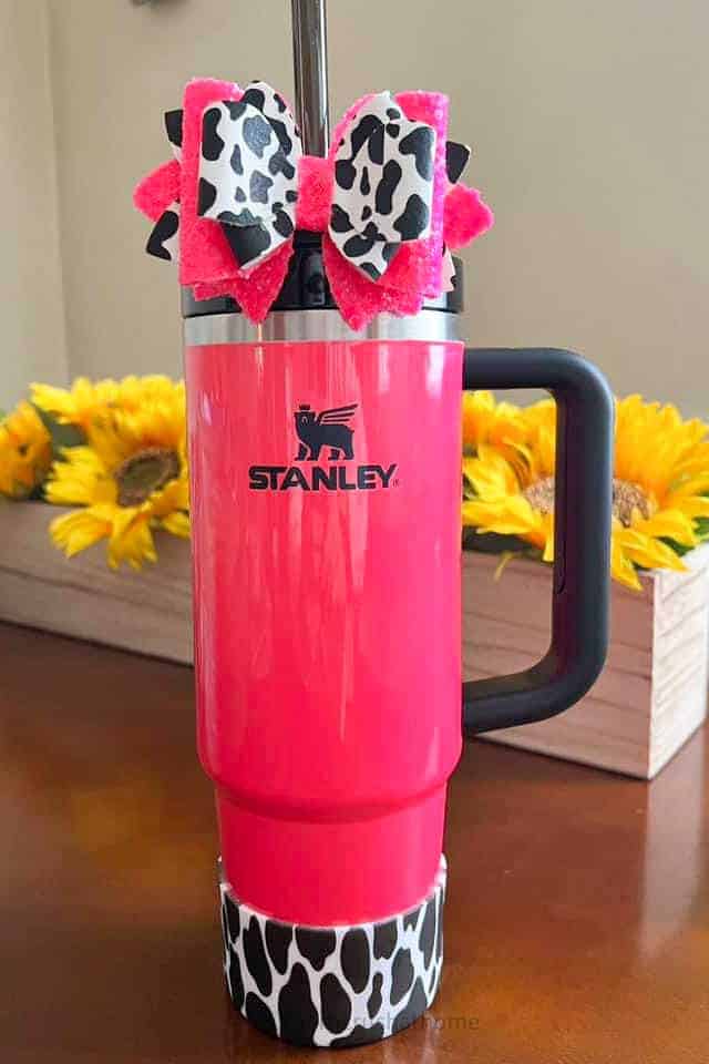 pink and black Stanley with cow print accessories