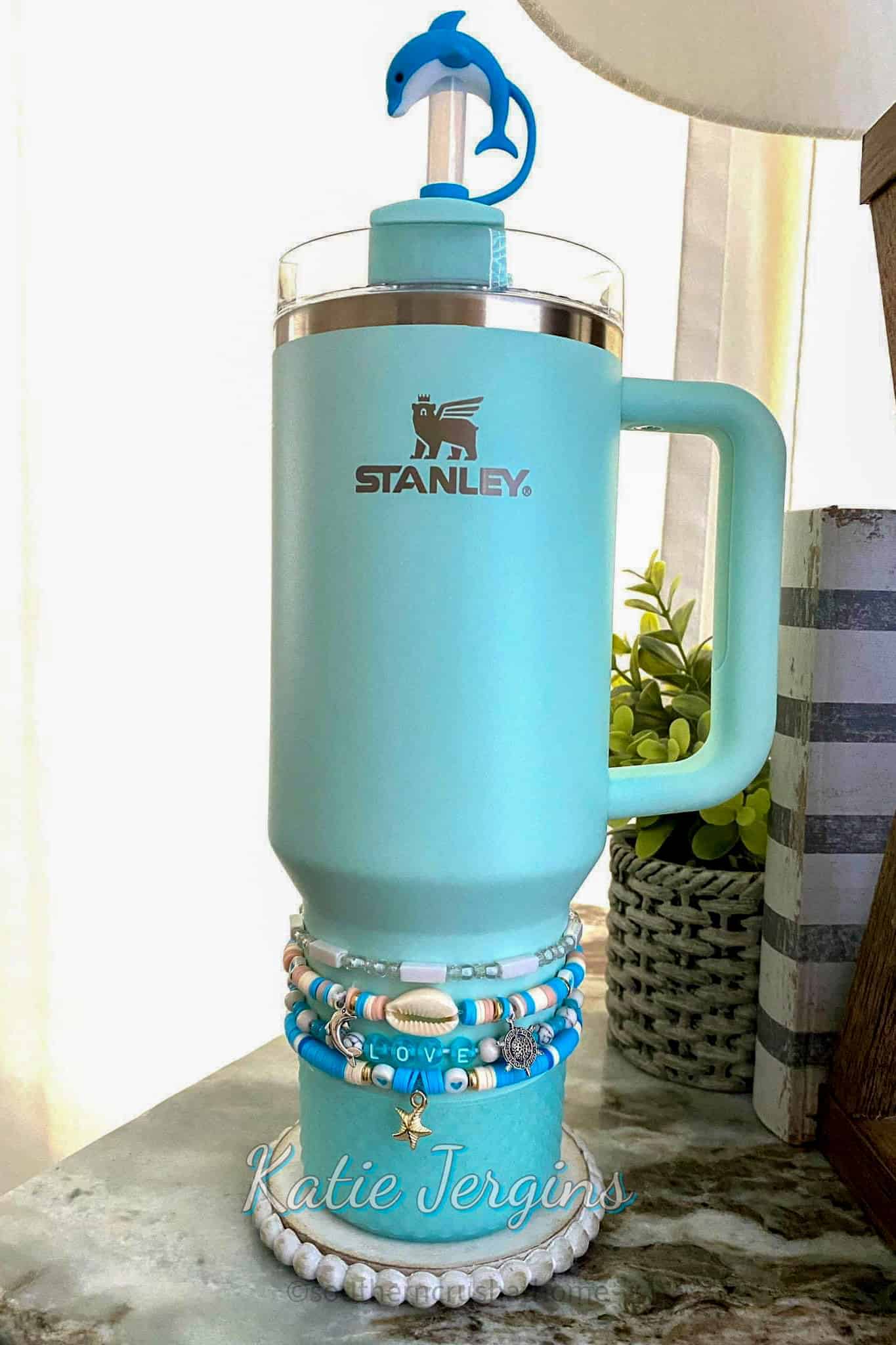 blue Stanley tumbler with seashells