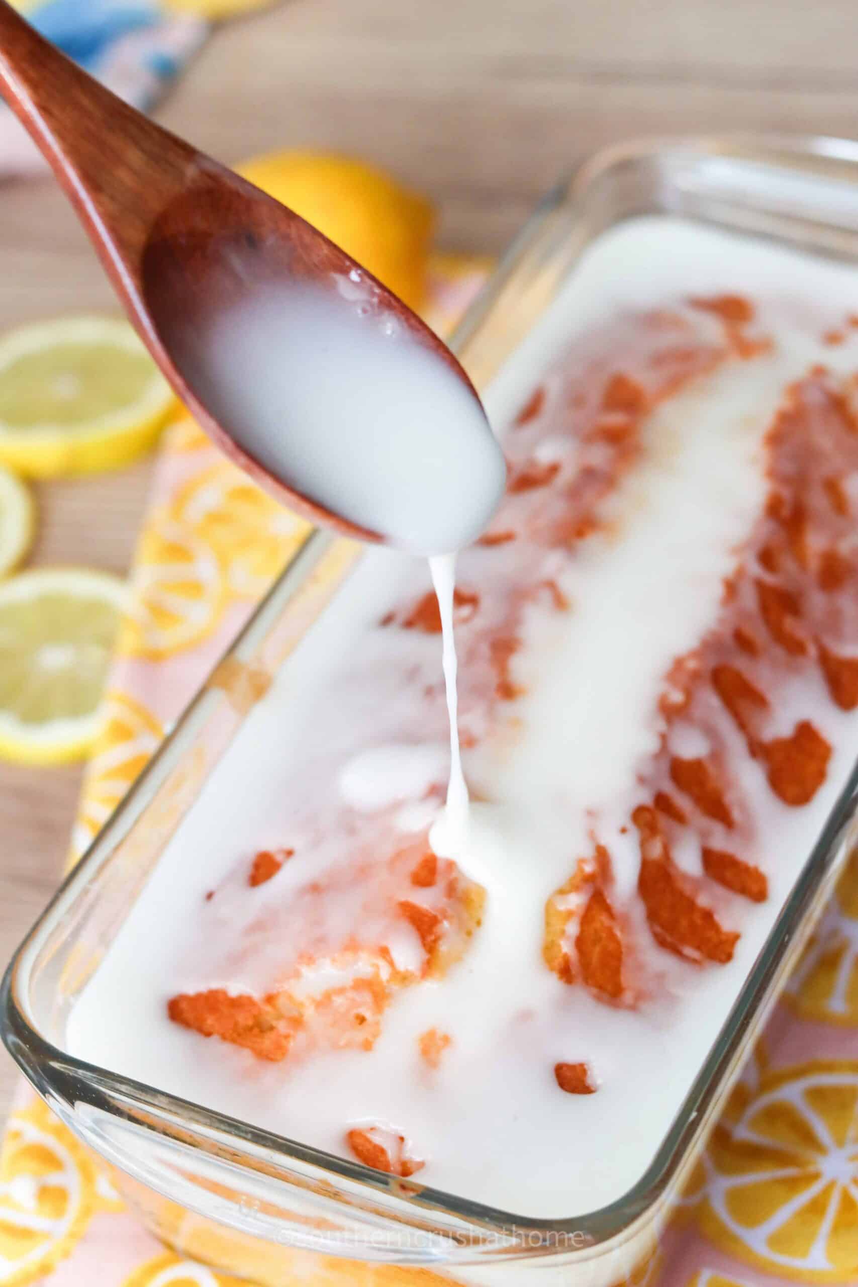 drizzling icing on lemon loaf