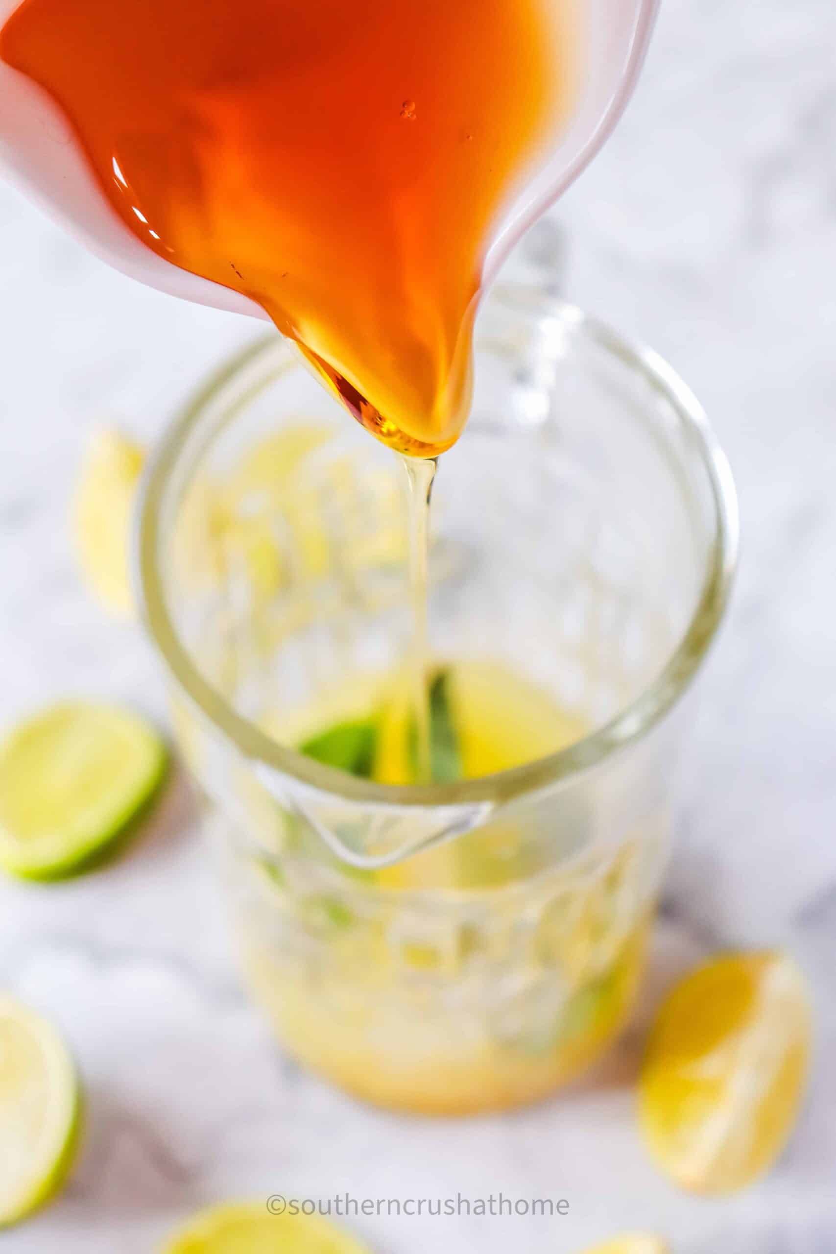 pouring agave into pitcher