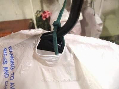 zip tie garbage sack storage for wreaths