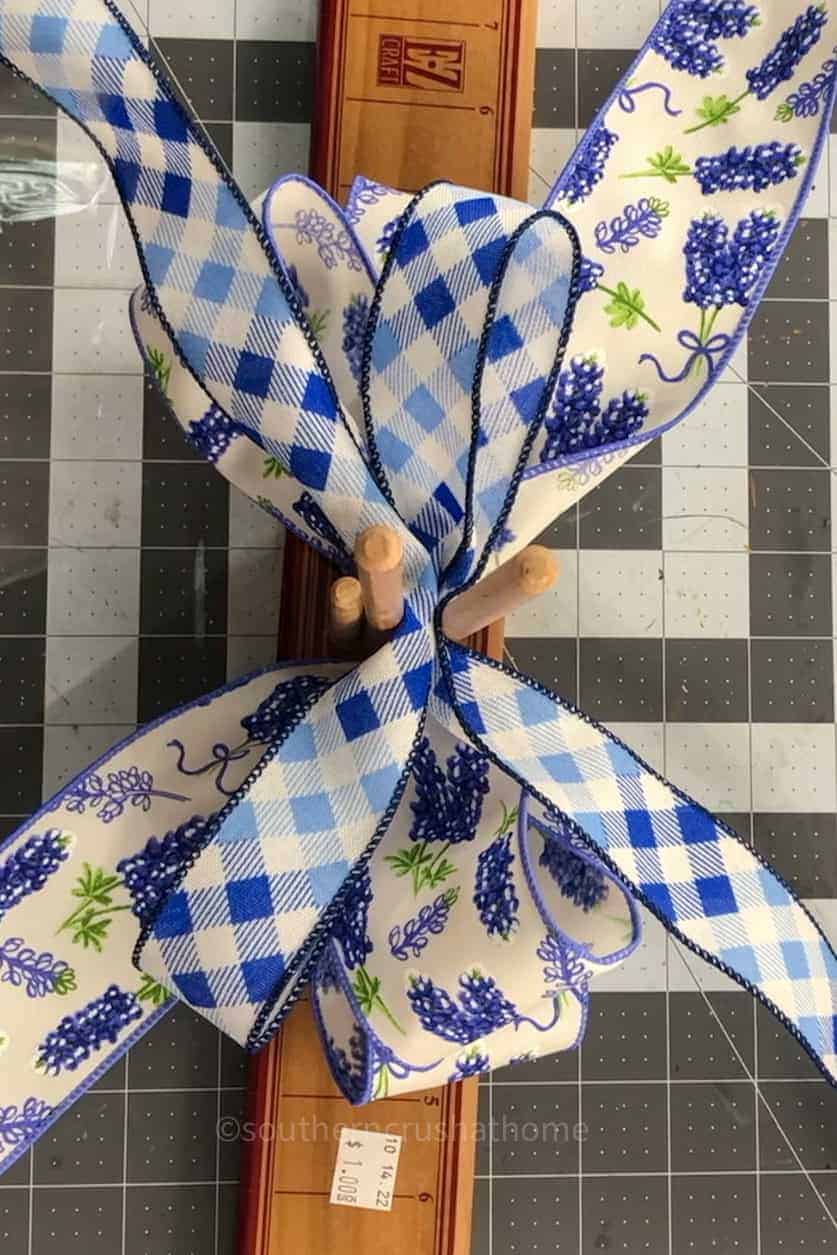 adding ribbon to bow