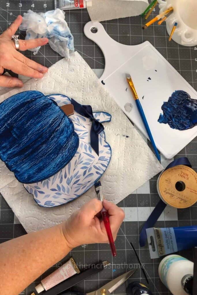 painting the edges of the pumpkin
