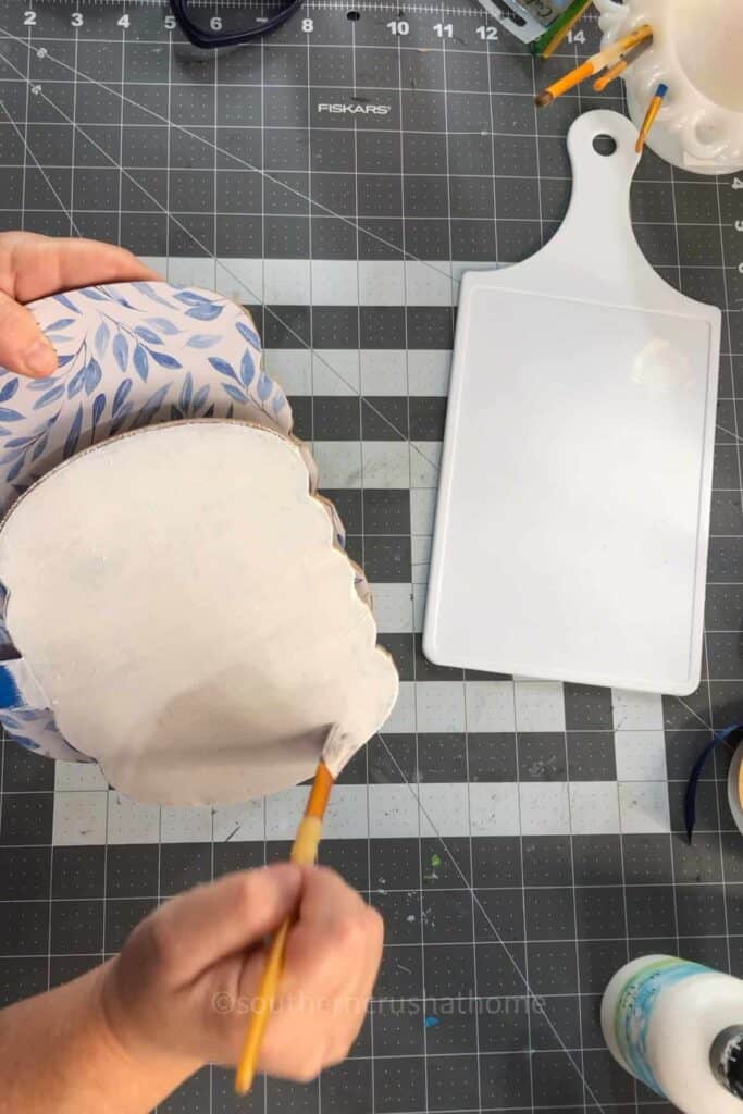 applying white paint