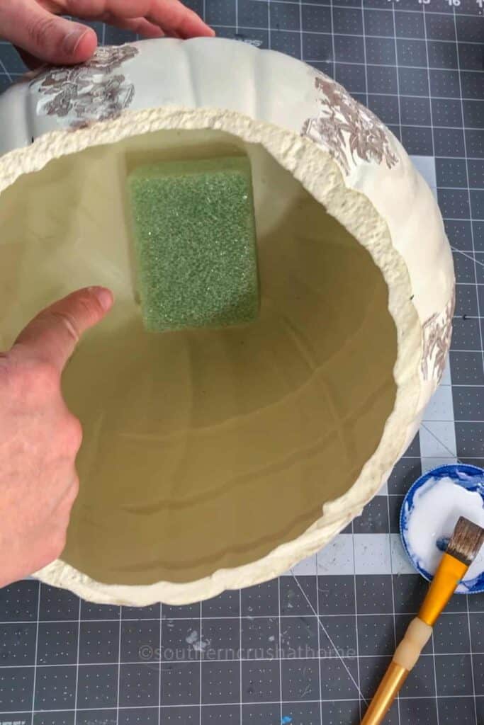 floral base inside pumpkin