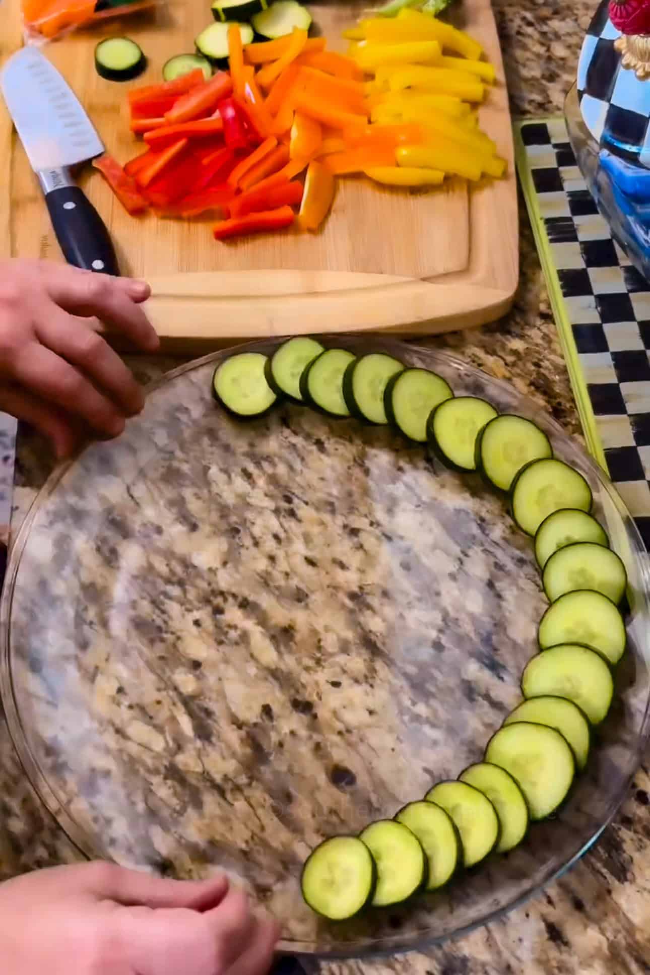 adding veggies to crudite platter