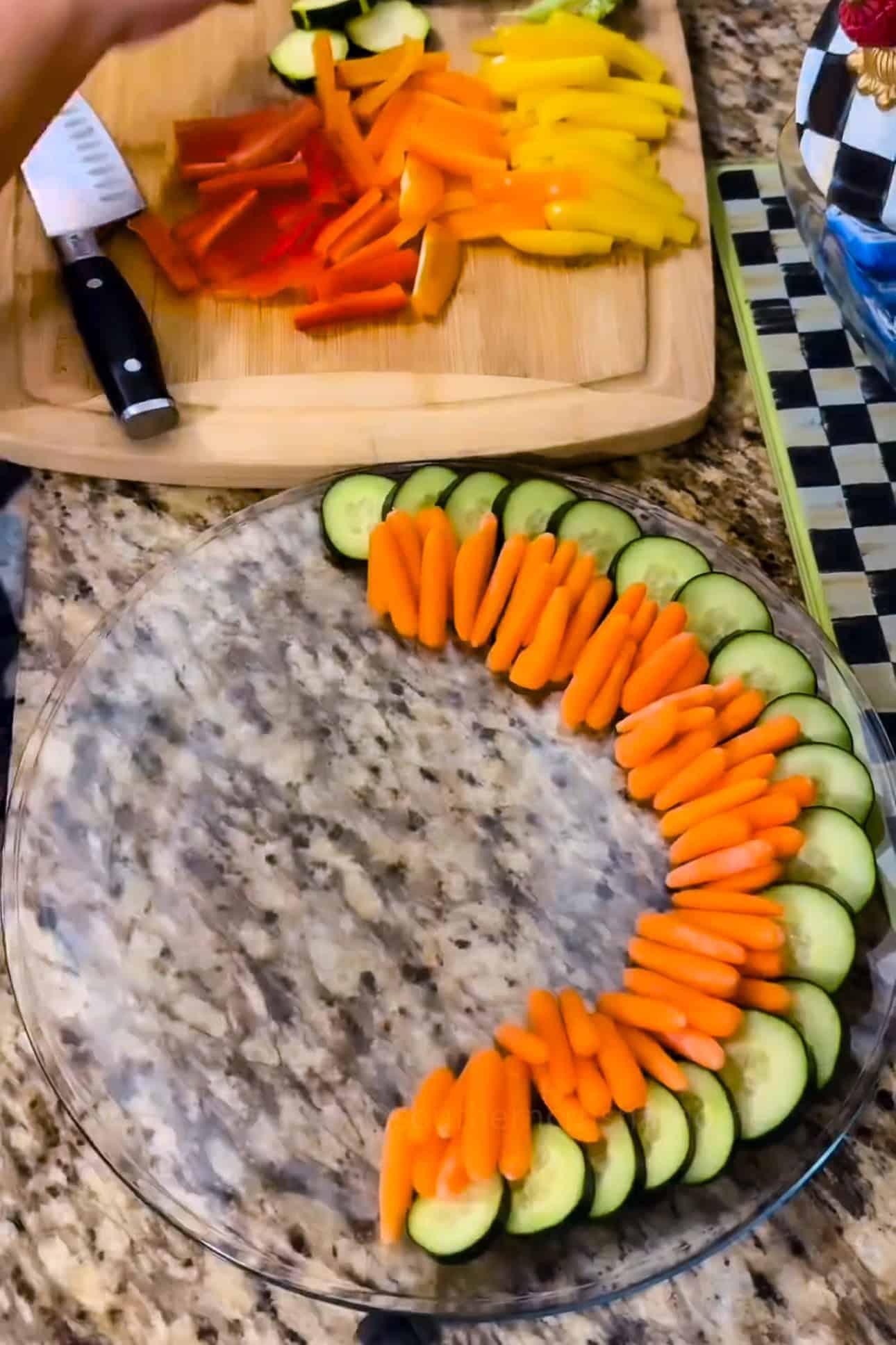 adding veggies to crudite platter