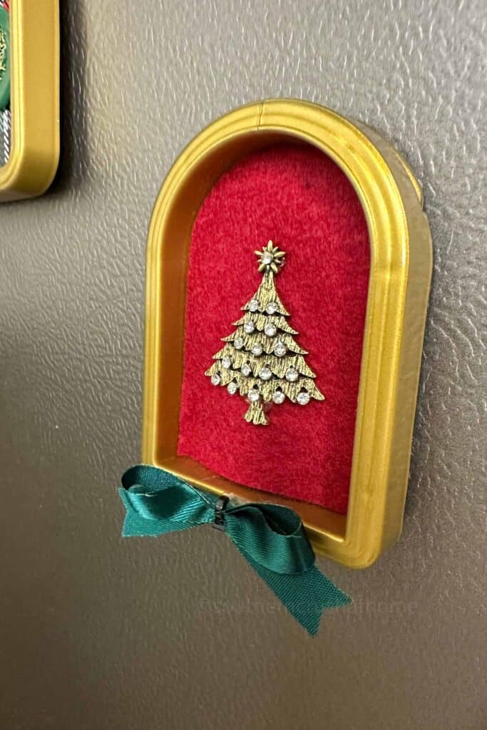 brooch on fridge magnet