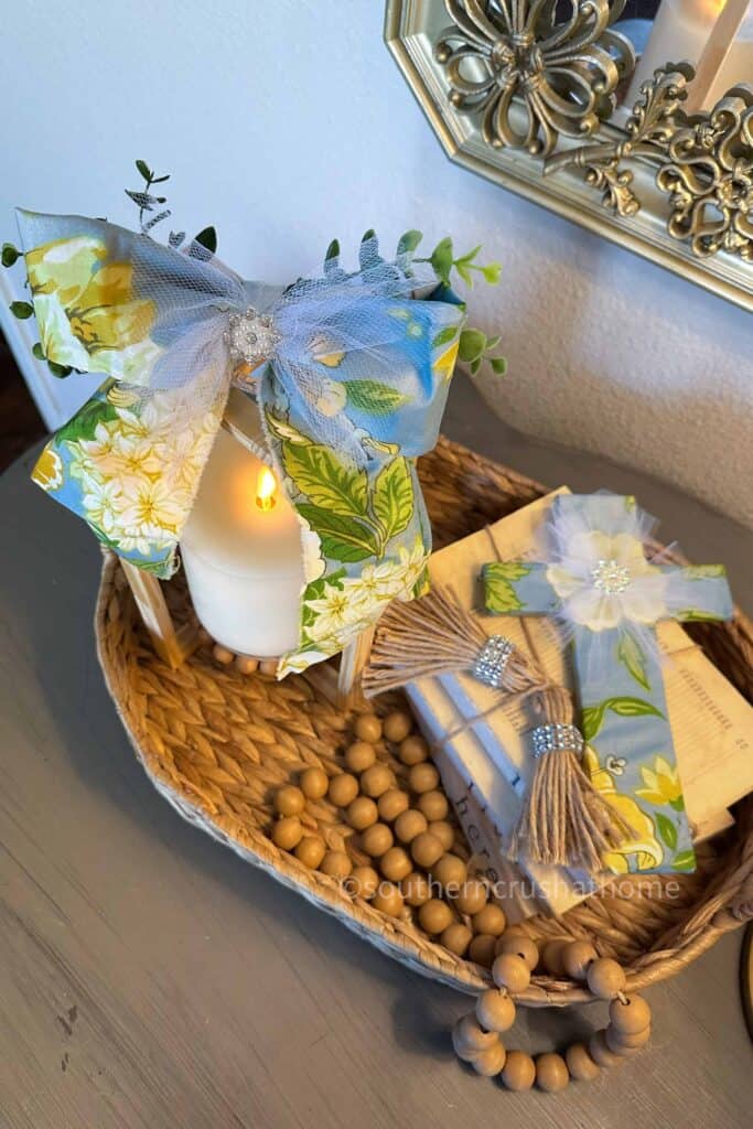 lantern and cross on styled tray