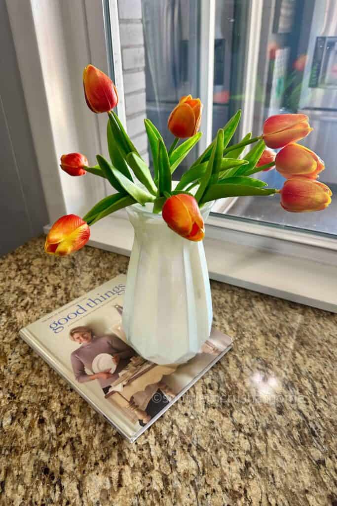 tulips in a vase with flower frog