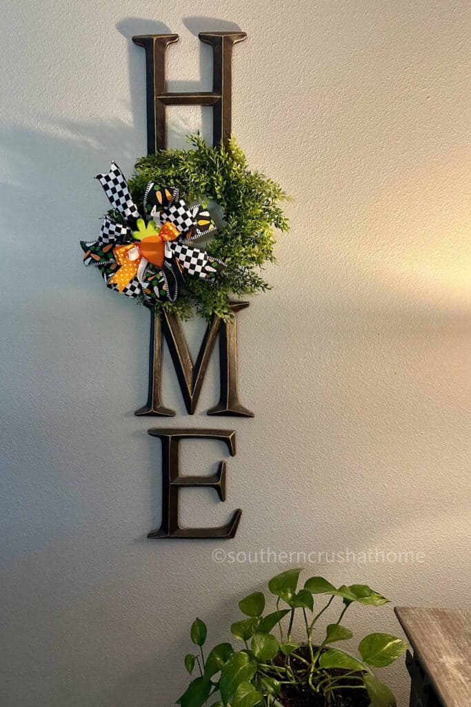 home sign with wreath