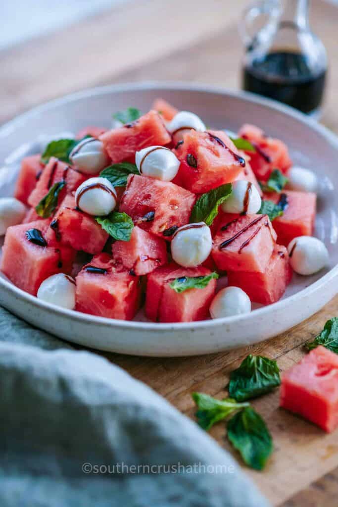 close up of watermelon salad with mozzerella pearls